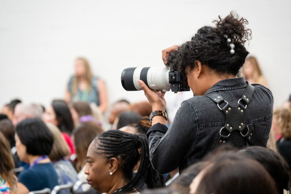 Expo photographer on site, shooting in expo hall