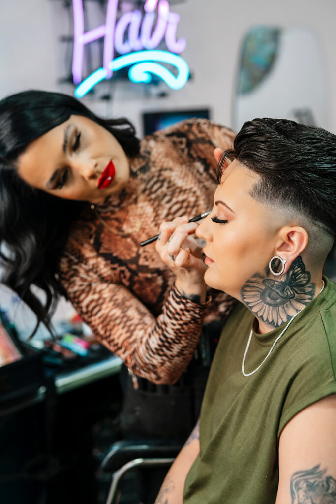 Masc bride getting make up done at Atomic Style Lounge