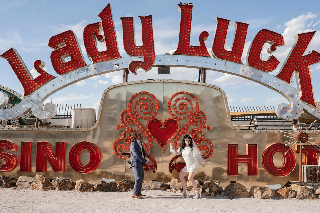 Bride and groom dancing at The Neon Museum