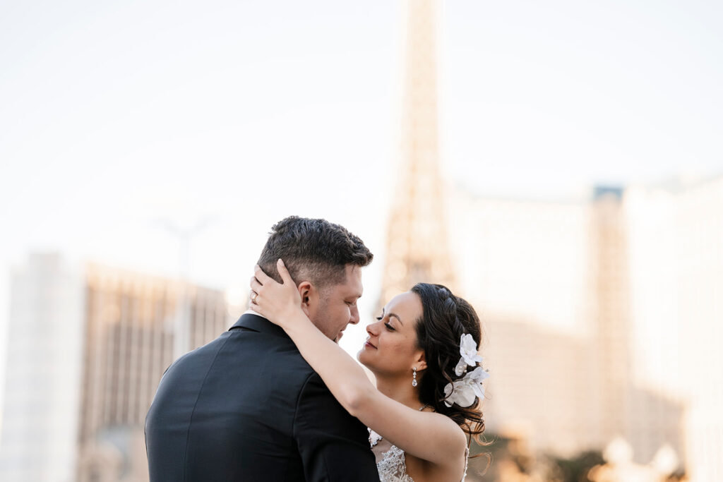 Bride and groom holding each other on the Las Vegas Strip