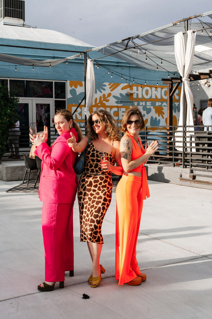 Wedding guests laughing and celebrating during a high energy cocktail hour at a large wedding photographed by a Las Vegas large scale wedding photographer