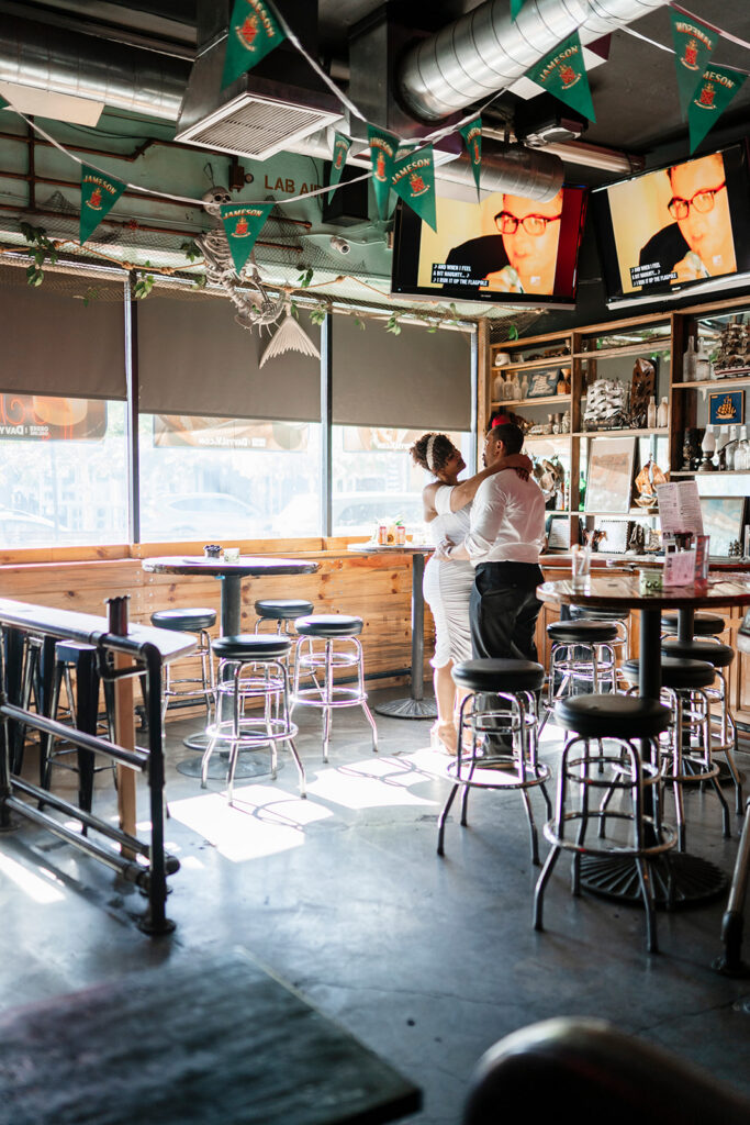 Elopement couple sharing their first dance during after-ceremony drinks at Davy’s Locker, illustrating the intimate, experience-first celebration that defines many modern elopements.