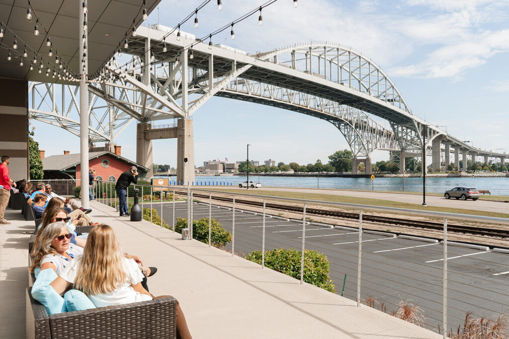attendees relax outside of Blue Water Convention in between general sessions