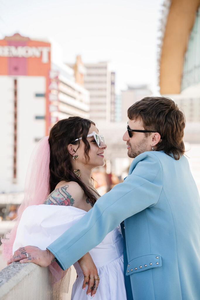 Couple embracing during their downtown elopement, illustrating the intimate, experience-first nature of modern elopements.