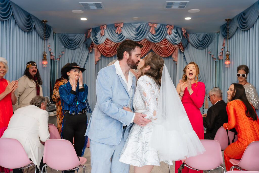Private elopement ceremony inside a Las Vegas chapel with close family witnessing the vows, reflecting the intimate structure that distinguishes elopements from larger weddings.