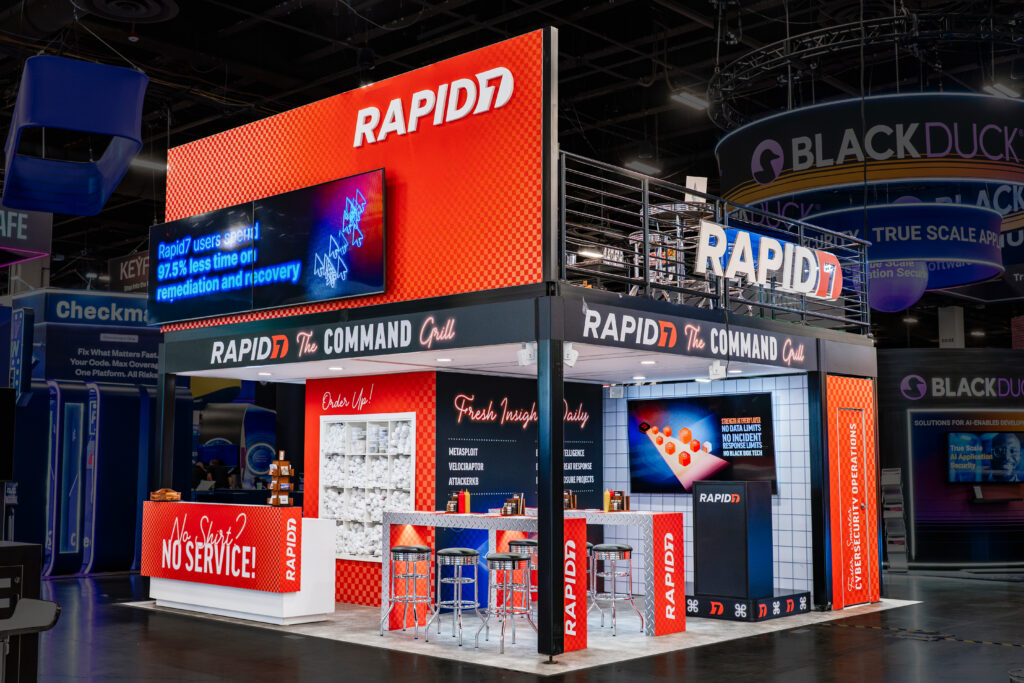 Exhibit Photography image isolating a booth with photo editing to showcase the design and footprint and branding.